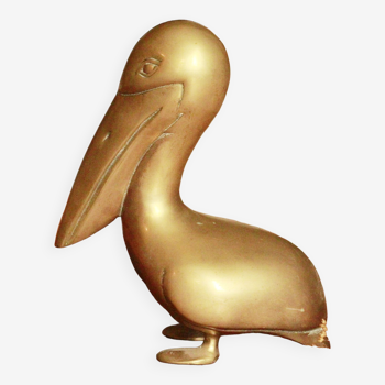 Ancient pelican statue in brass