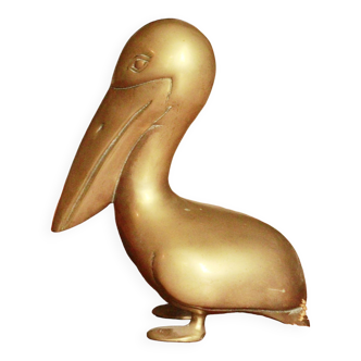 Ancient pelican statue in brass