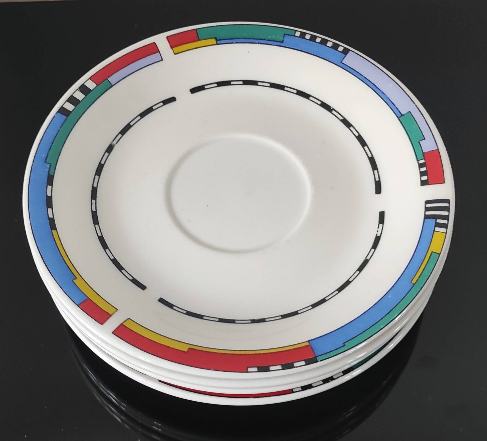 Set of small plates, vintage saucers in porcelain.
