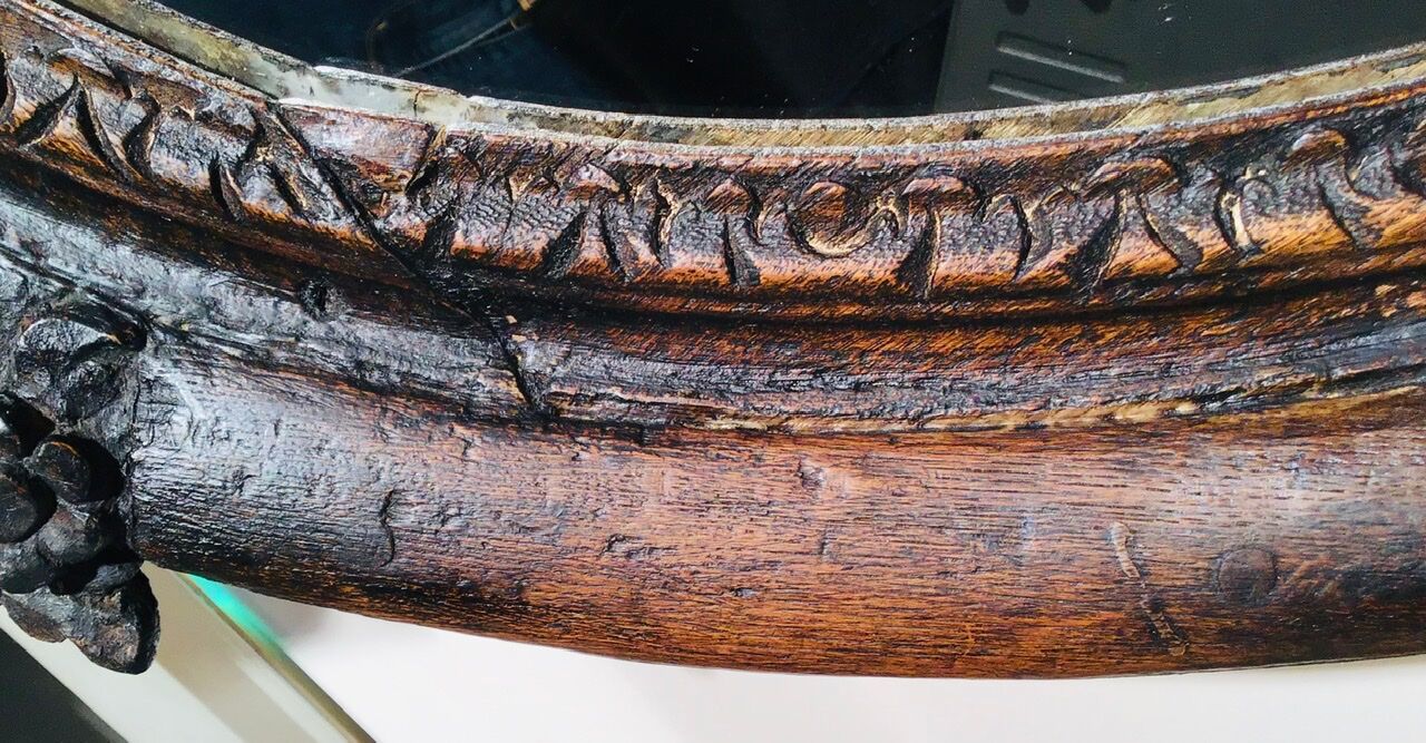 Oval mirror on an 18th century frame