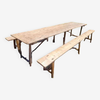 Old folding farm table with two benches