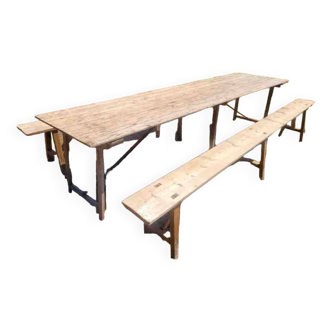 Old folding farm table with two benches