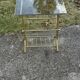 Mid-century modern brass and smoked glass side table with integrated magazine holder, 1970s
