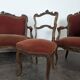Louis XV style salon in carved walnut with orange velvet, seven pieces.
