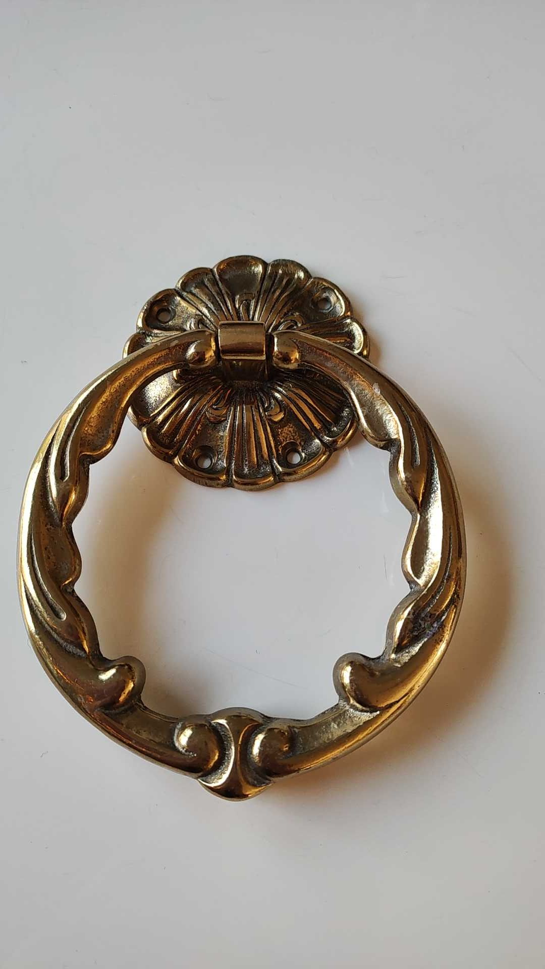 Antique door knocker/hammer of floral shape with large ring decorated with scrolls of acanthus