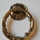 Antique door knocker/hammer of floral shape with large ring decorated with scrolls of acanthus
