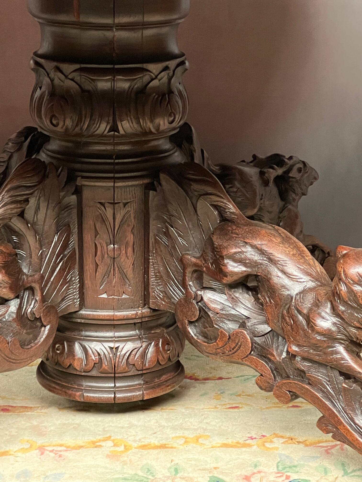 Hunting style dining table with figures of four different animals.