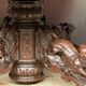 Hunting style dining table with figures of four different animals.