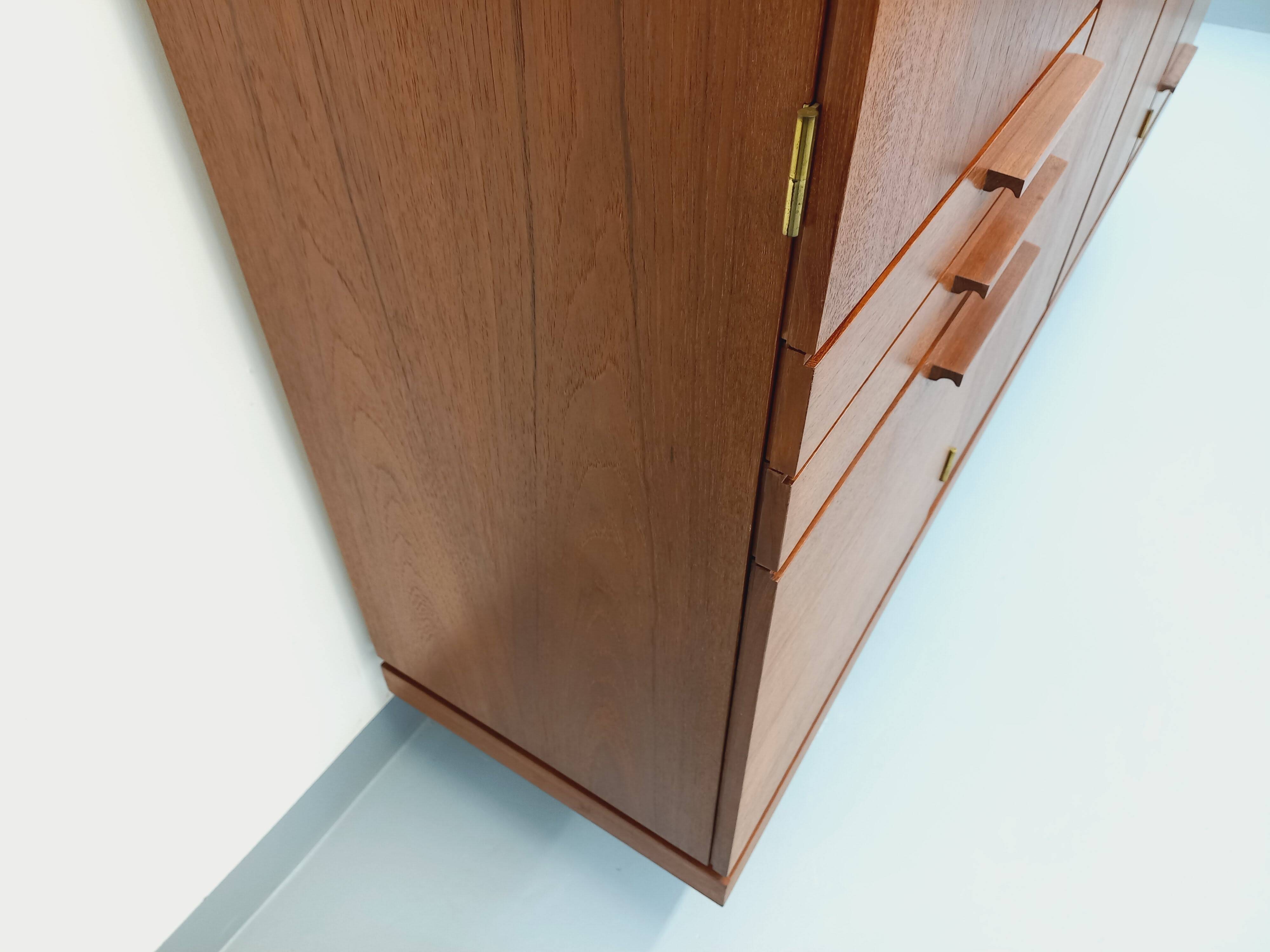 High Scandinavian modernist vintage sideboard in teak and black metal.