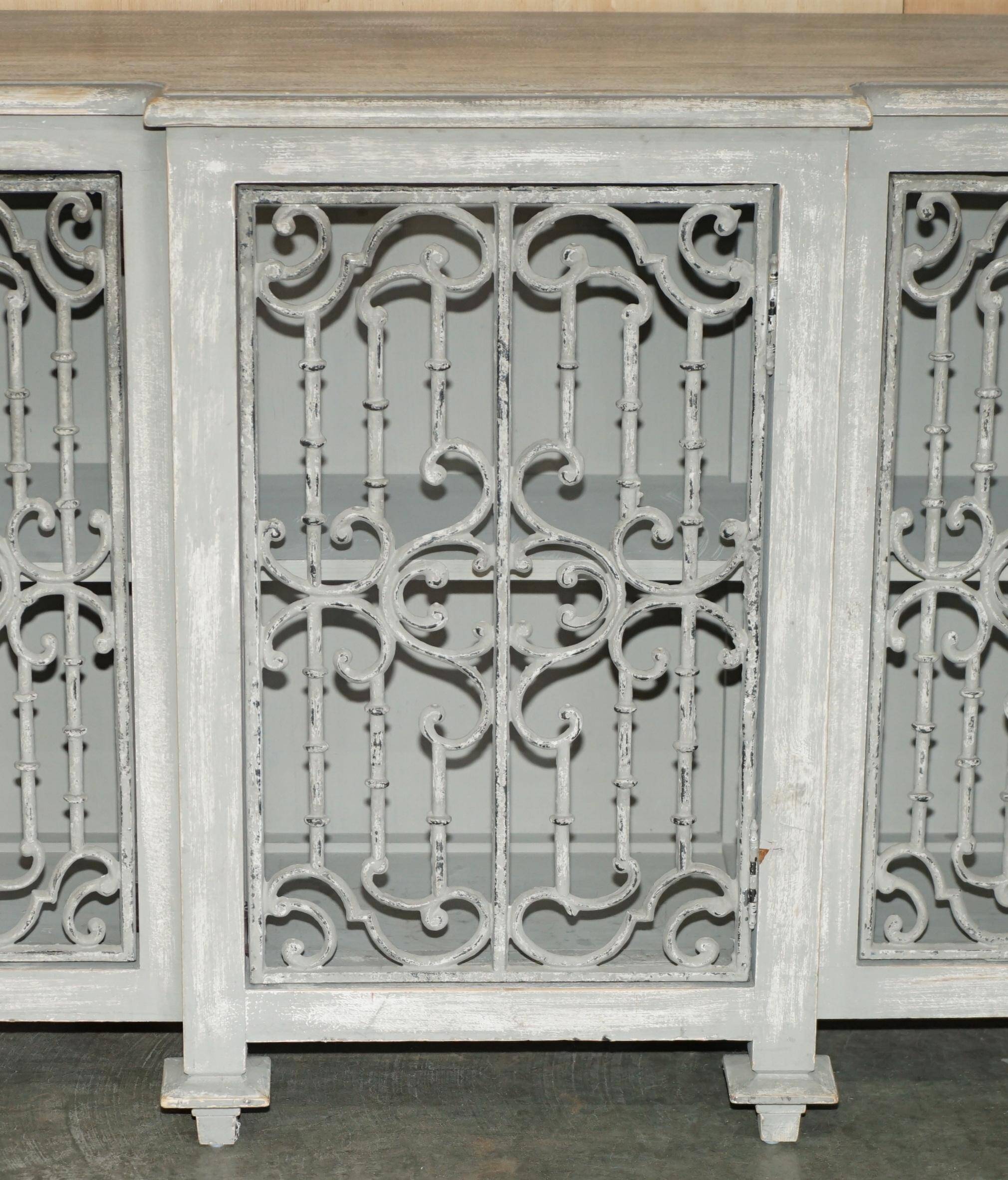 Vintage sideboard with wrought iron doors