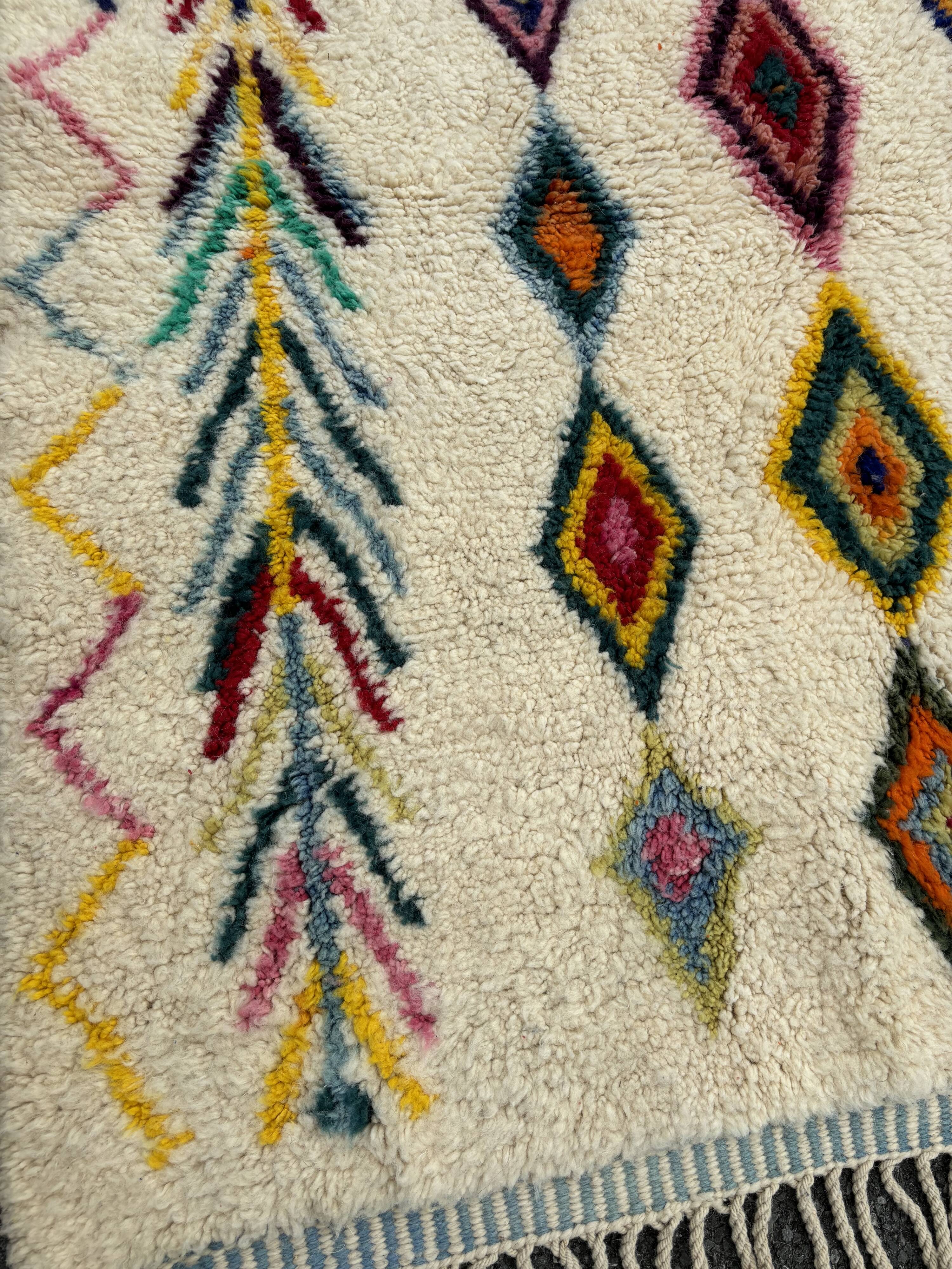 M'rirt Berber rug in cream wool with coloured patterns, 160 × 190 cm