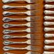 Christofle France, 12 dessert knives and 12 dessert forks in new condition.