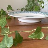 Plat à gâteau ancien sur piédouche en faïence de Sarreguemines