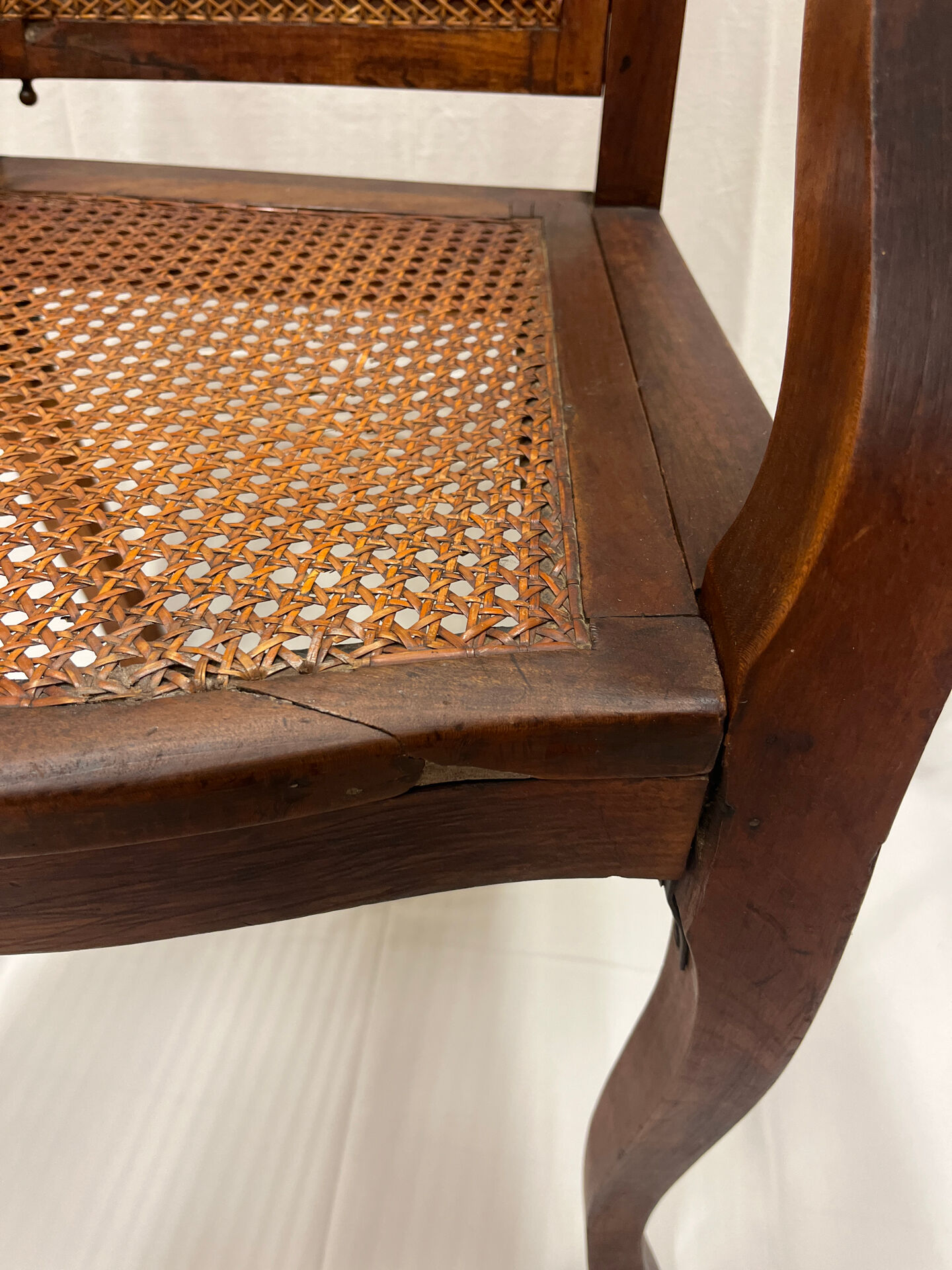 Caned armchair