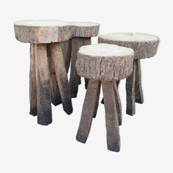 4 stools in raw wood brutalist art