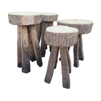 4 stools in raw wood brutalist art