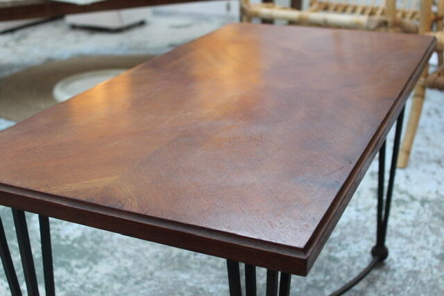 Black metal footing wooden coffee table