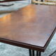 Black metal footing wooden coffee table