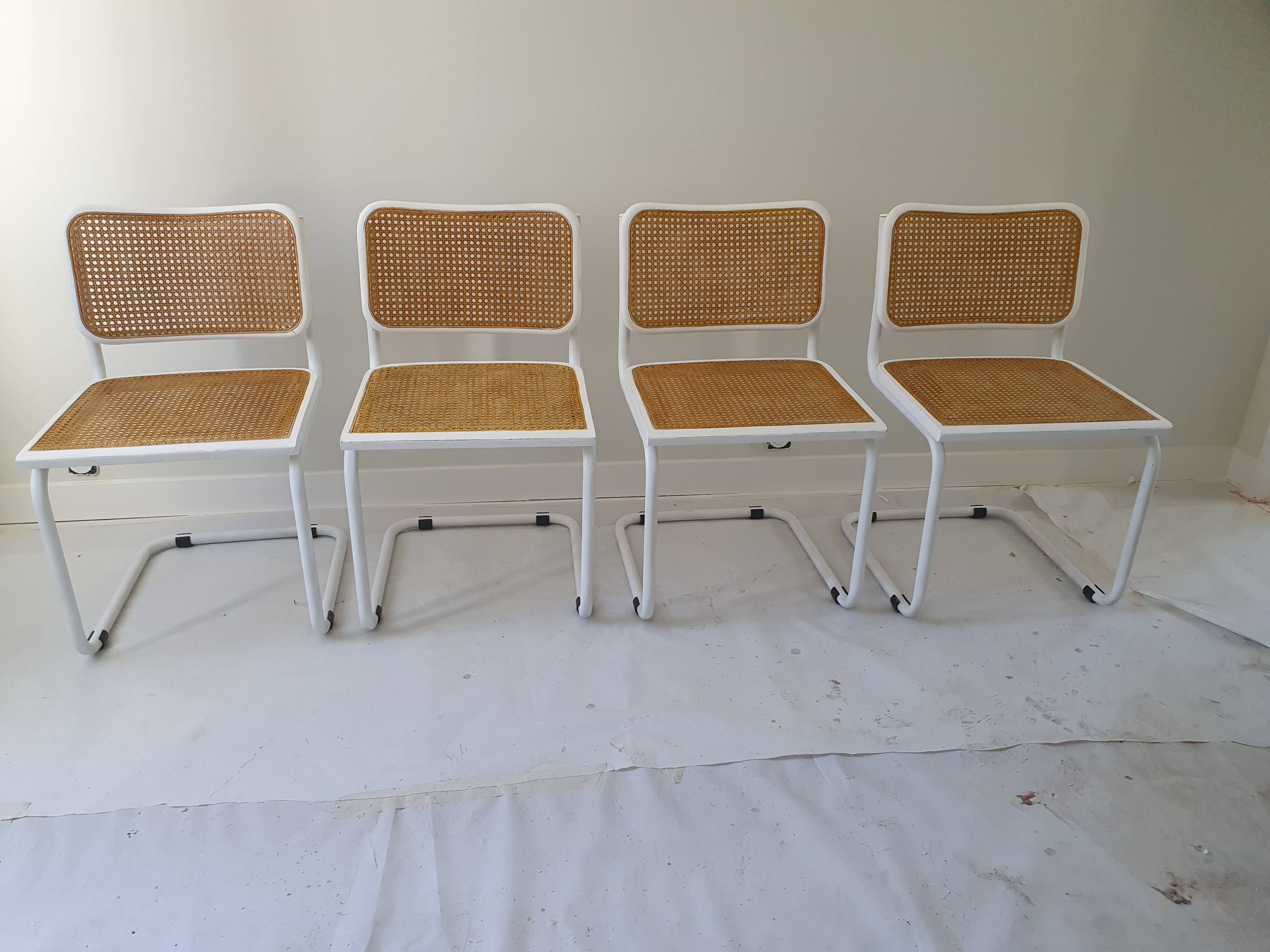 B32 chairs by Marcel Breuer in white.
