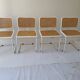 B32 chairs by Marcel Breuer in white.