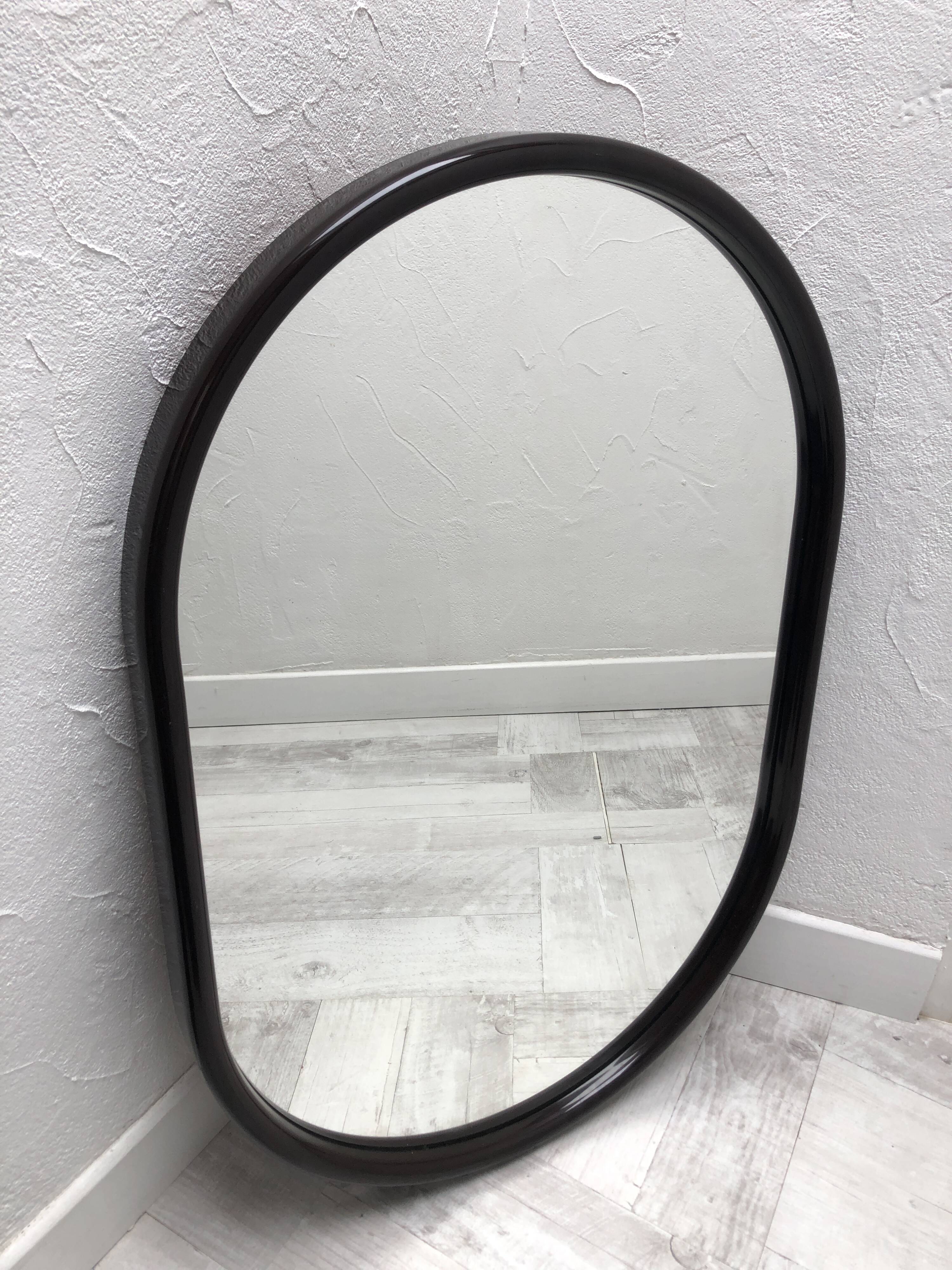 Brown plastic oval mirror, 1960s/1970s