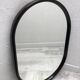 Brown plastic oval mirror, 1960s/1970s