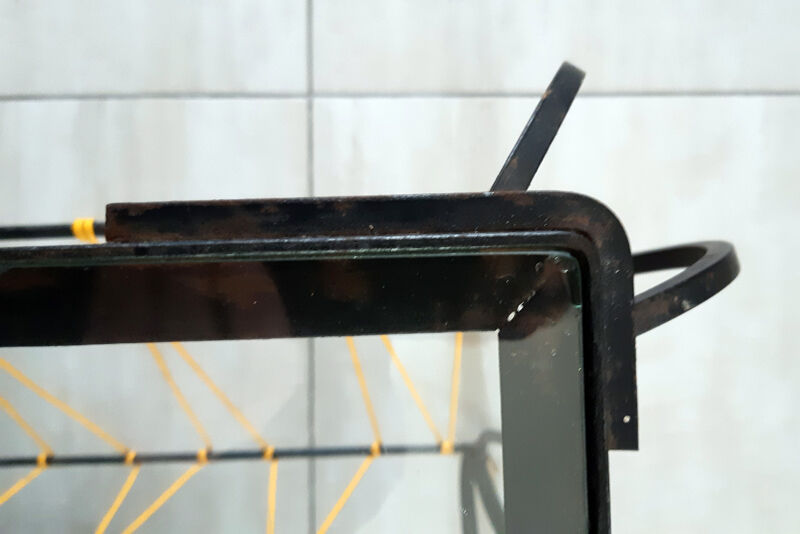 Vintage magazine holder "scoubidou" in black wrought iron.