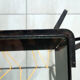 Vintage magazine holder "scoubidou" in black wrought iron.