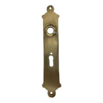 Door handle plate with brass keyhole