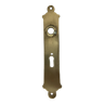Door handle plate with brass keyhole