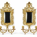 Pair of Napoleon III wall sconces in gilded bronze, with bevelled mirrors.