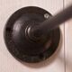 Antique cast iron wall bracket and enamelled globe, 1950s