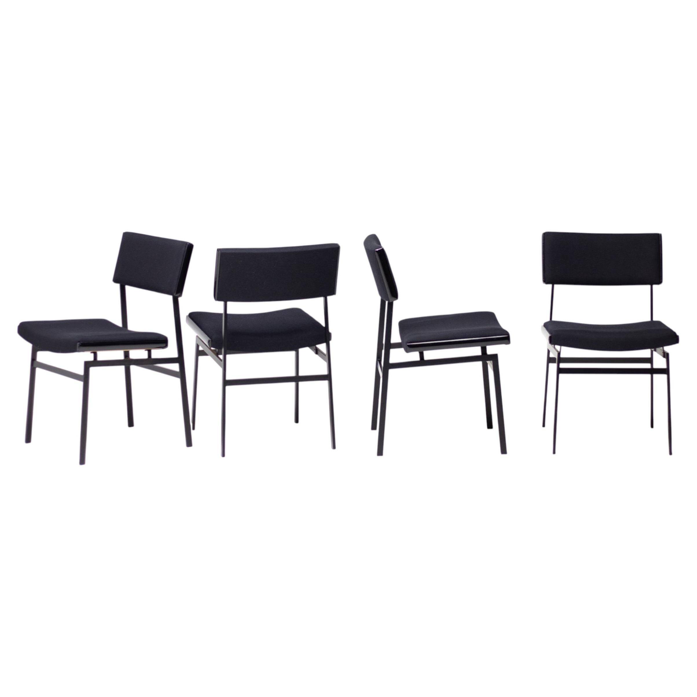 Set of four entirely black Hulmefa dining chairs, Architectural Modernism.