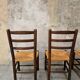 4 wooden and straw chairs