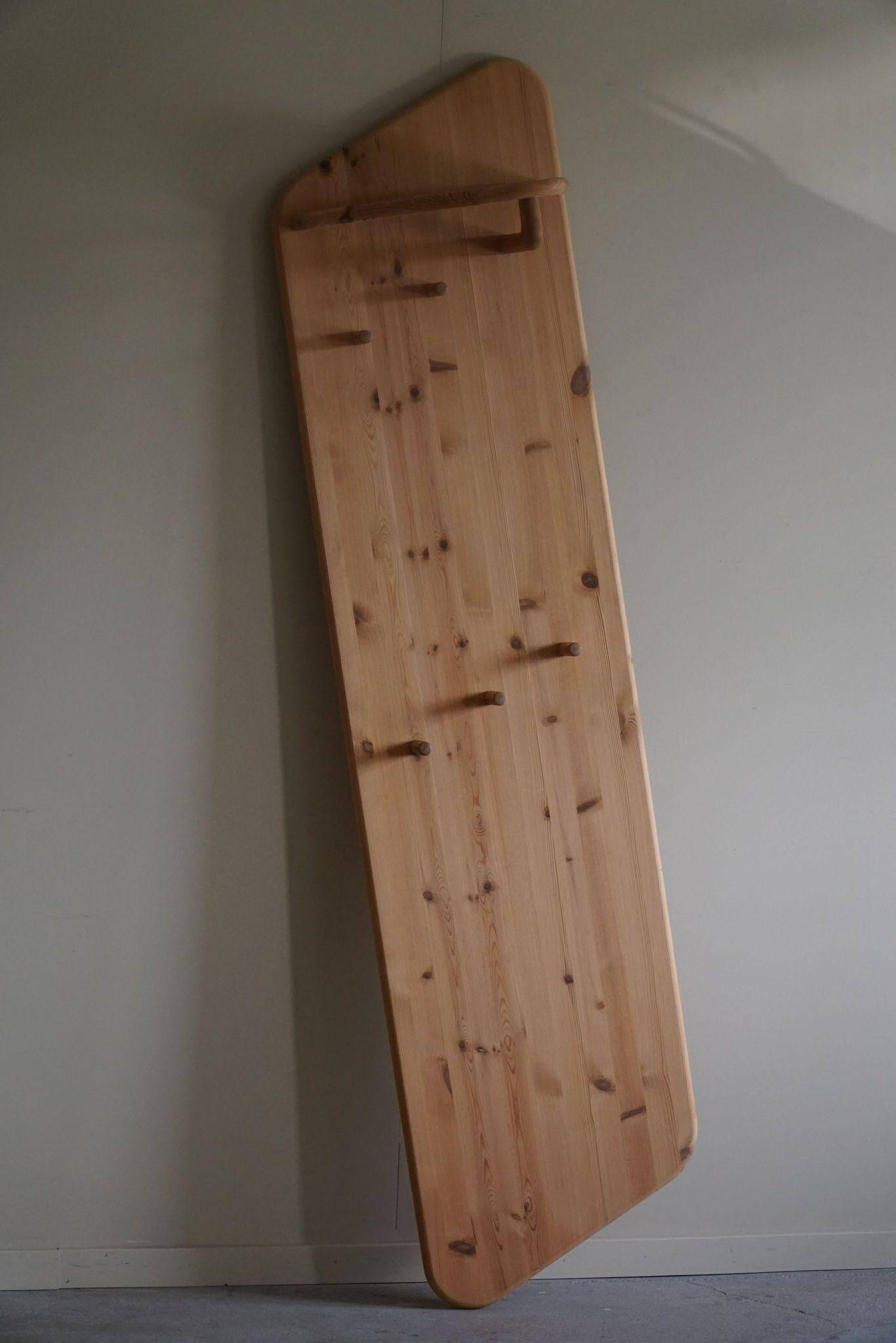 Sculptural wall-mounted coat rack in solid pine, Danish modern, 1980s.