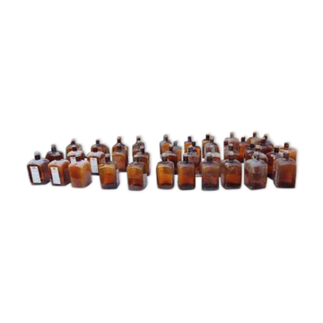 Set of 41 brown glass pharmacy bottles.