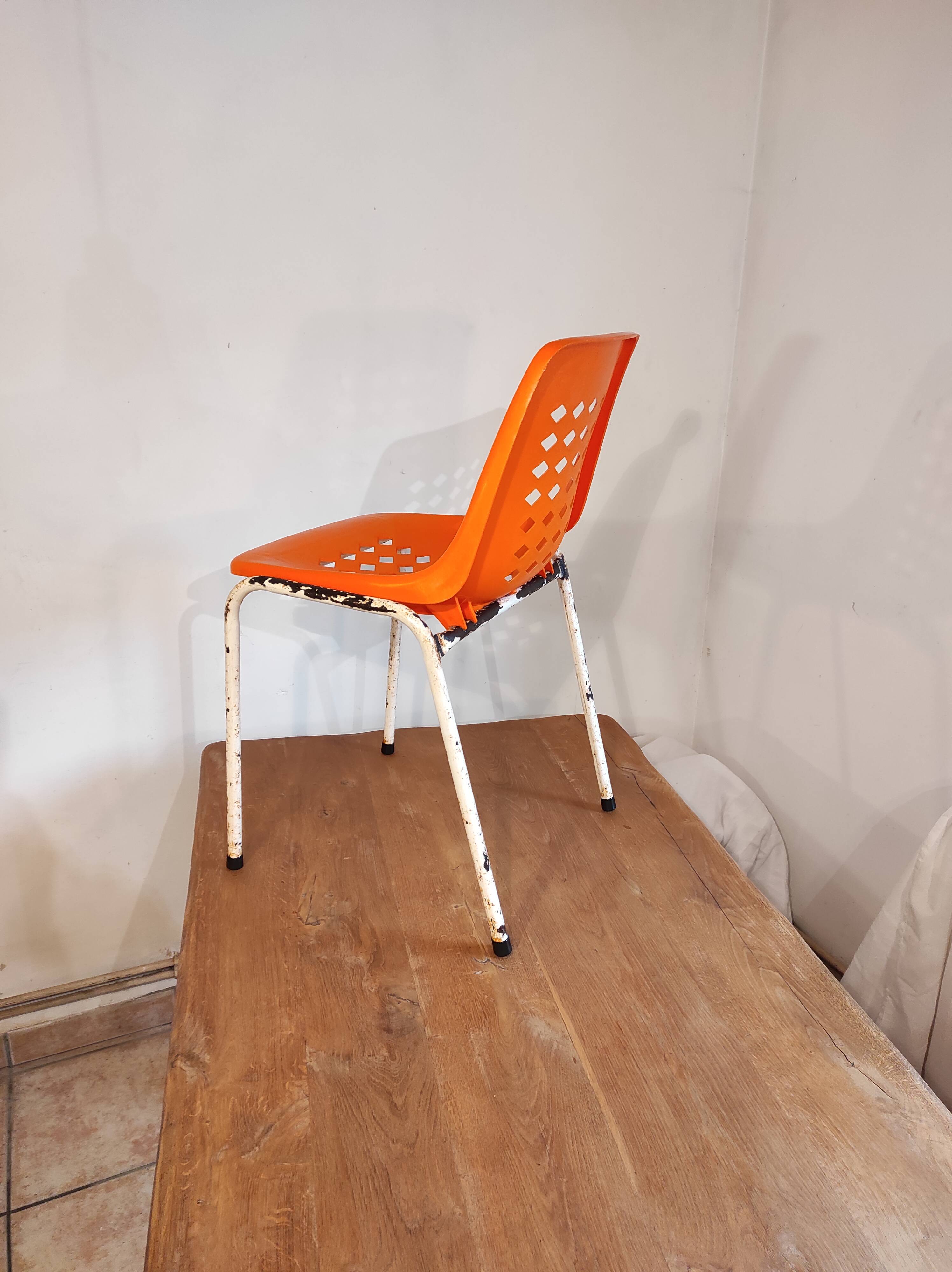 Chair with openwork plastic shell 1970