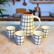 Tisslit glass, handcrafted with a black and white checkered pattern.