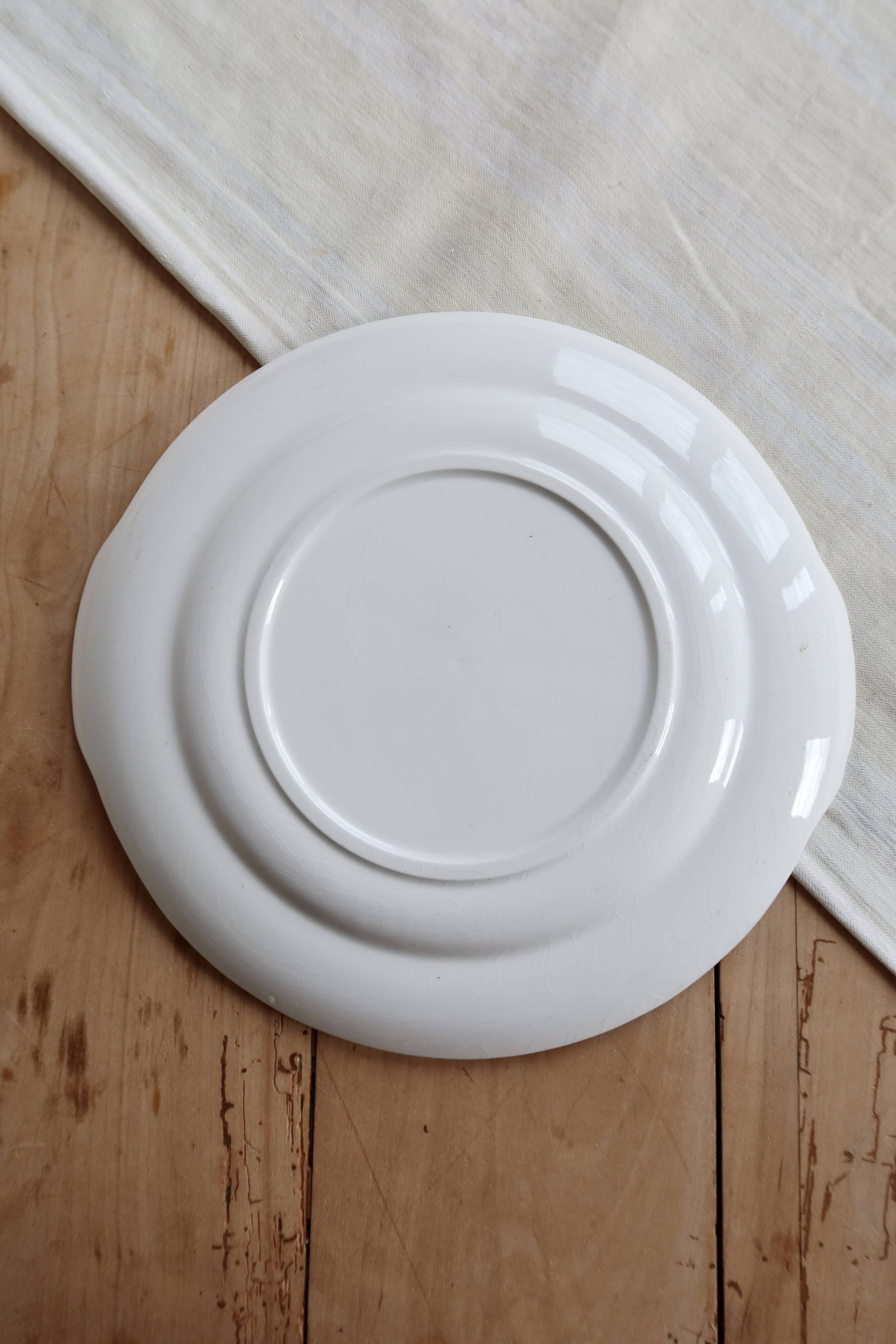 Vintage round white porcelain serving dish with handles.