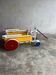 Rietveld-style De Stijl handcart in painted wood — white frame with red, blue, yellow accents