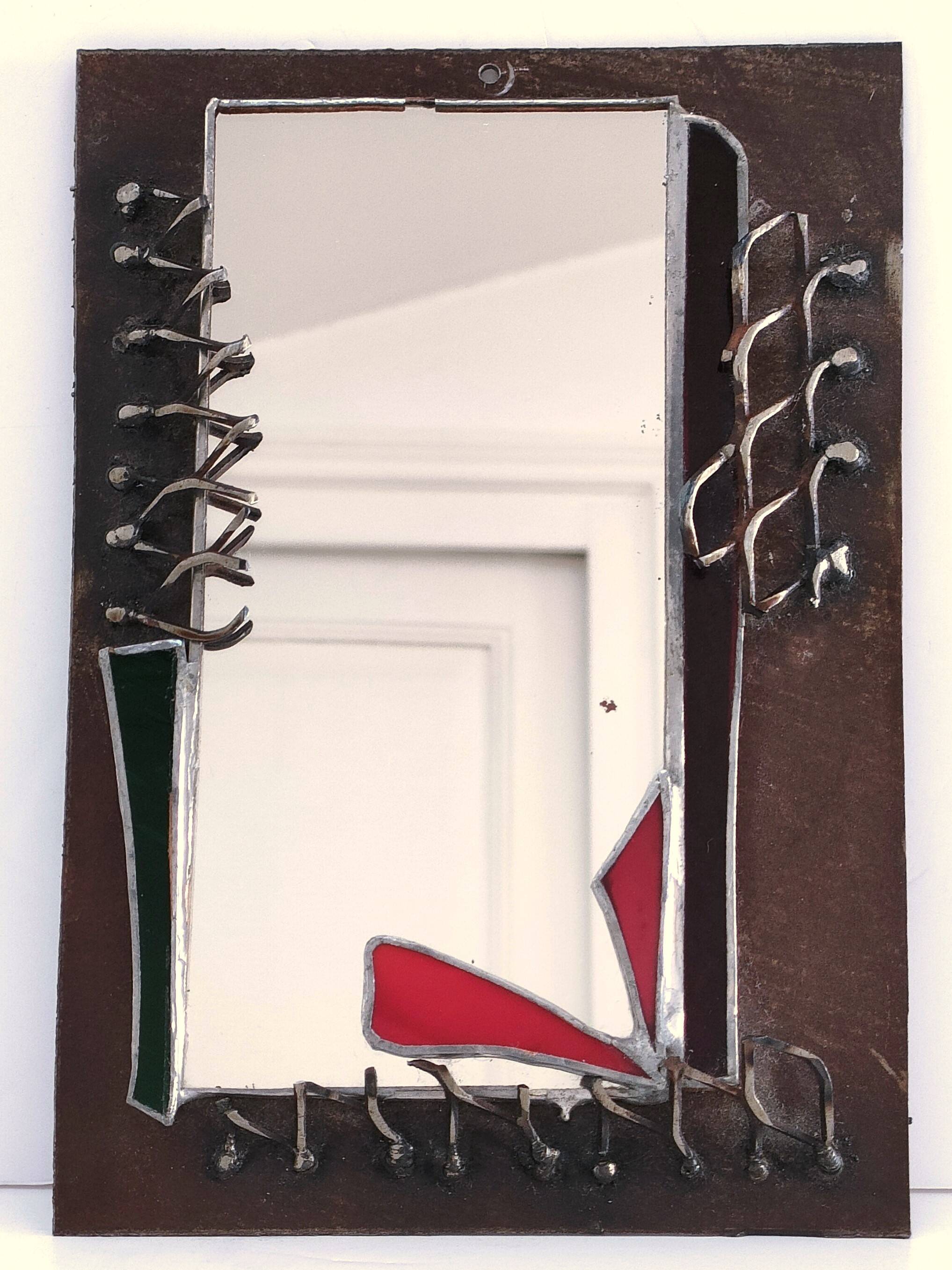 Brutalist mirror in metal and set glass
