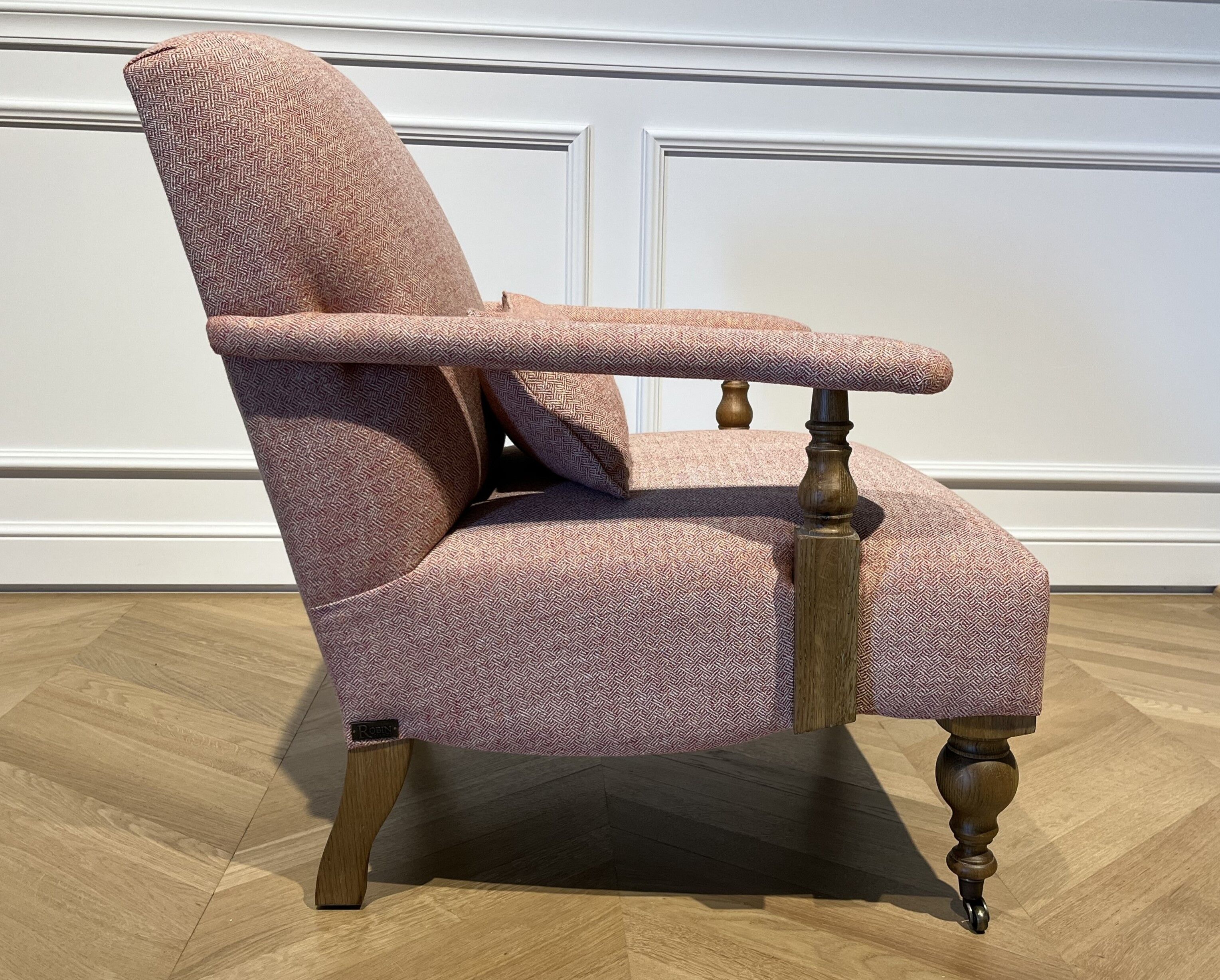 Wooden and red chevron fabric armchair with casters