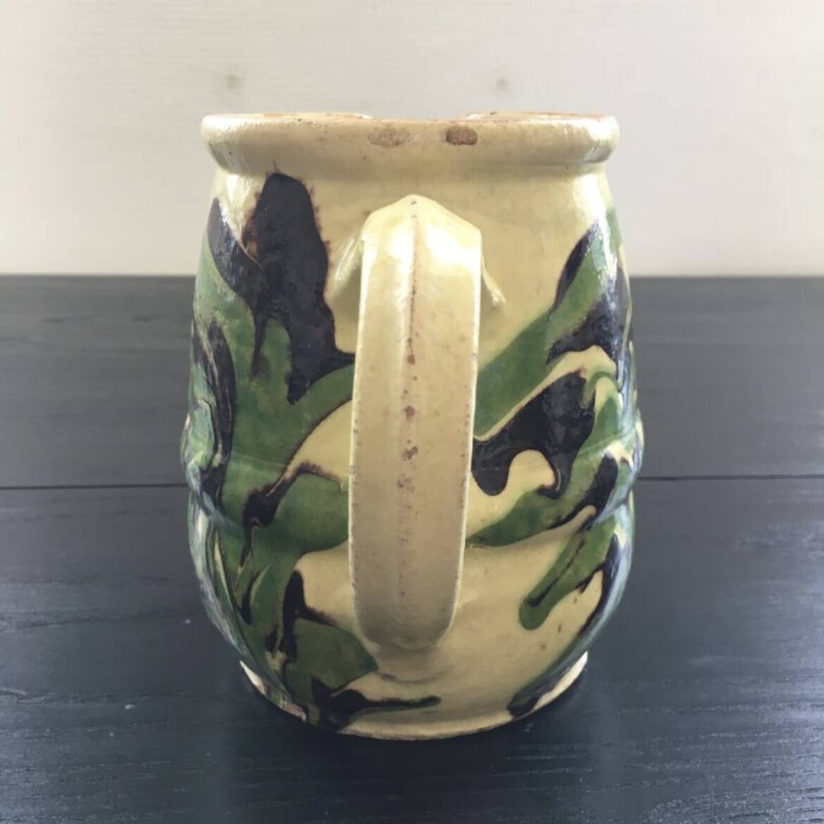 Antique pitcher of mixed earth