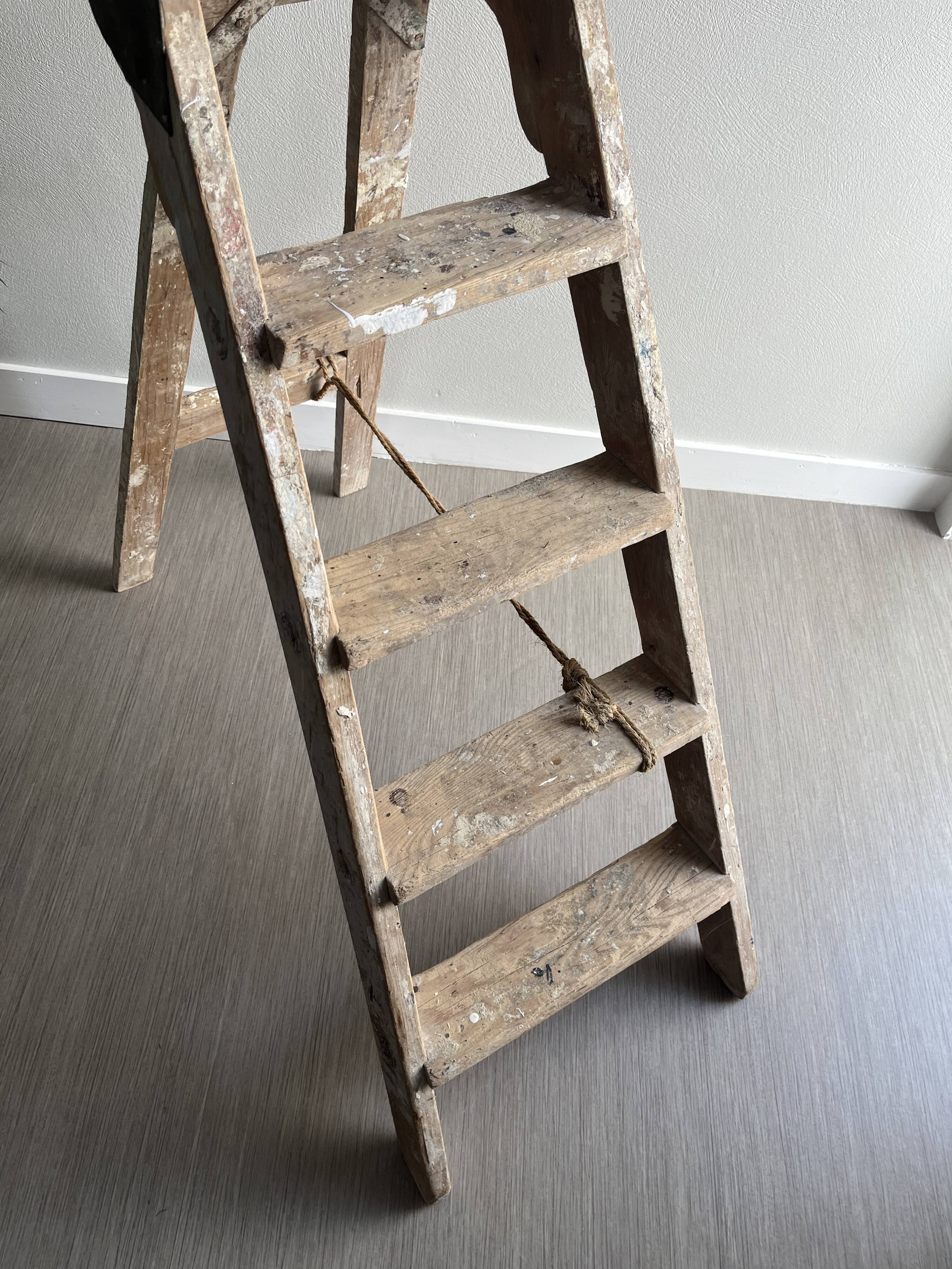 Former stepladder of patinated wood painter