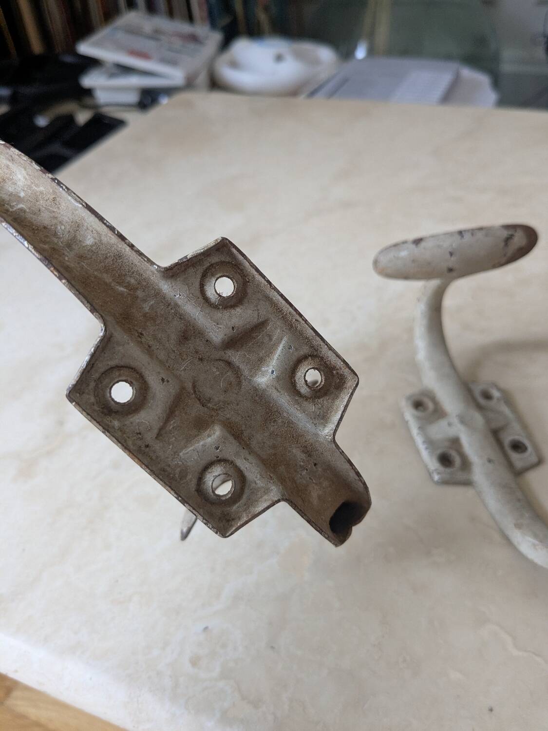 Two vintage coat hooks