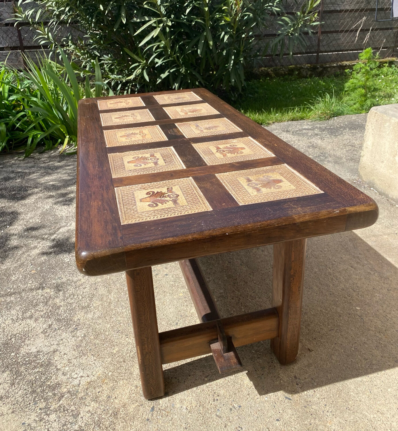 Vintage 60s coffee table with tile decoration of birds and flowers.