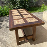 Vintage 60s coffee table with tile decoration of birds and flowers.