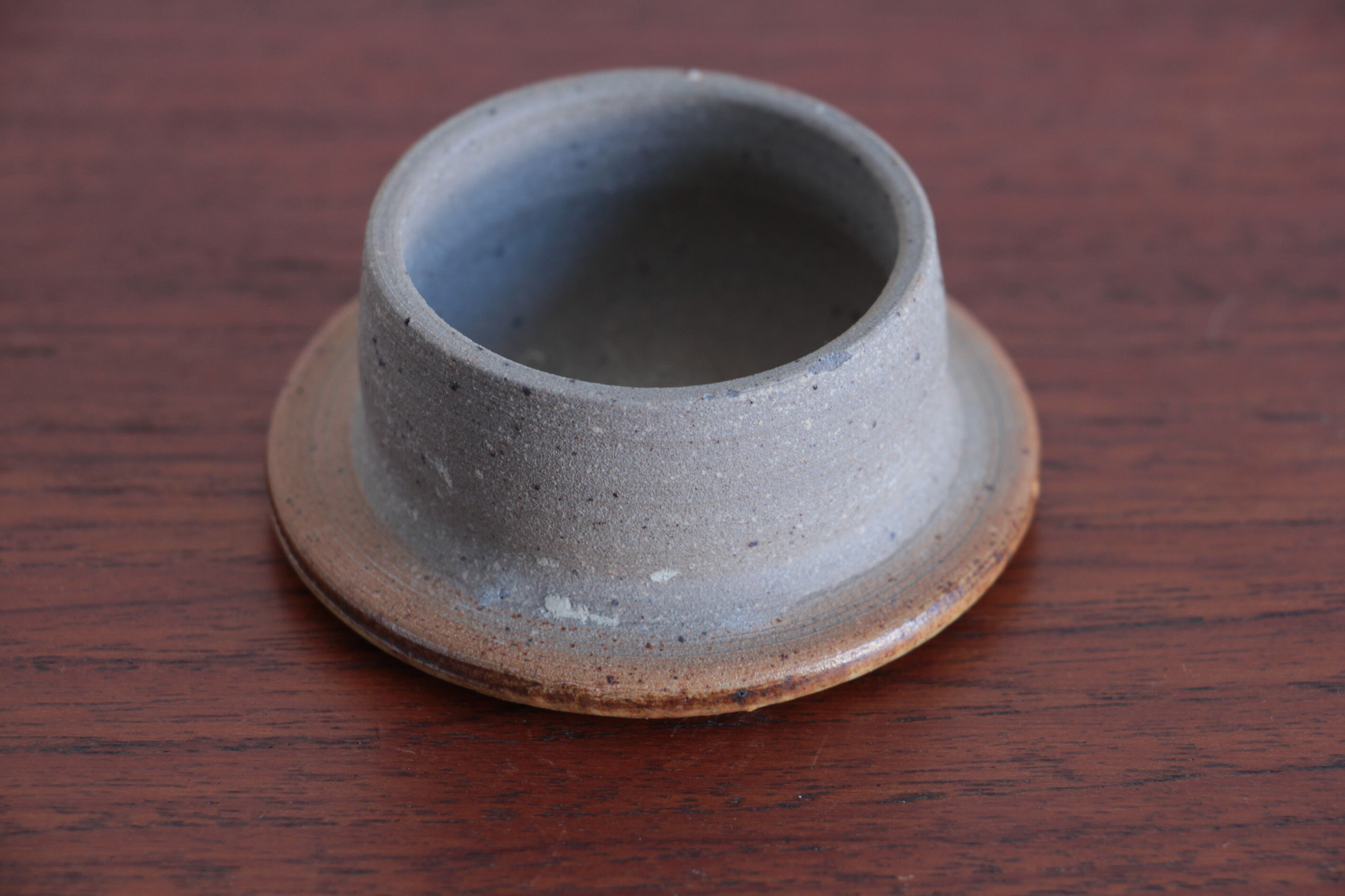 Sandstone teapot with rattan handle