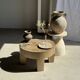 Petrified wood catchall or dish in beige with several grey spots in the centre.