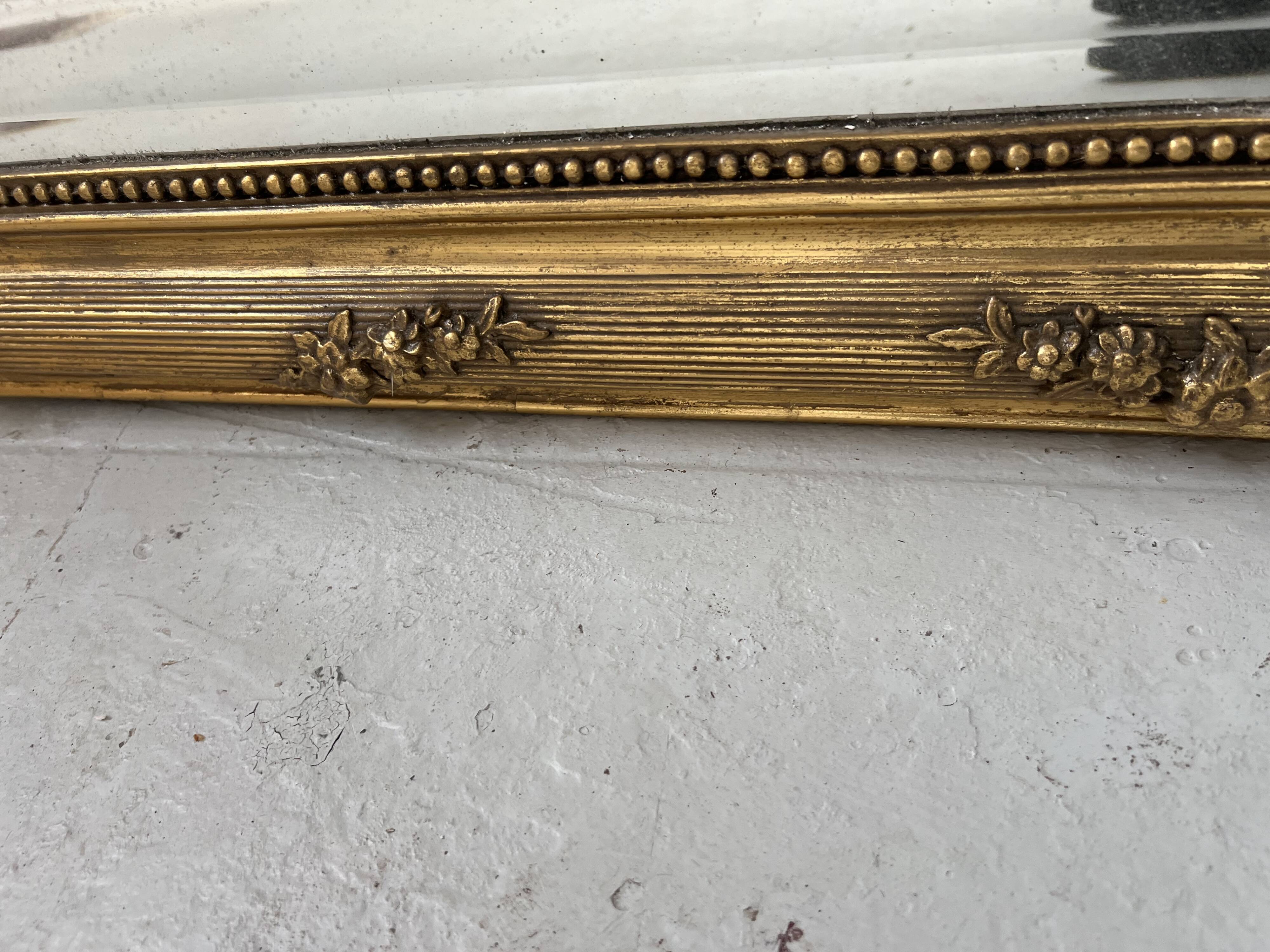 Louis XVI style mirror in wood and gilded stucco, 19th century